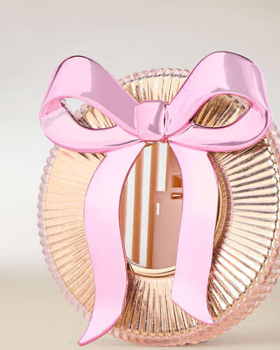 PORTA AROMATIZANTE PARA AUTO - MOÑO ROSA